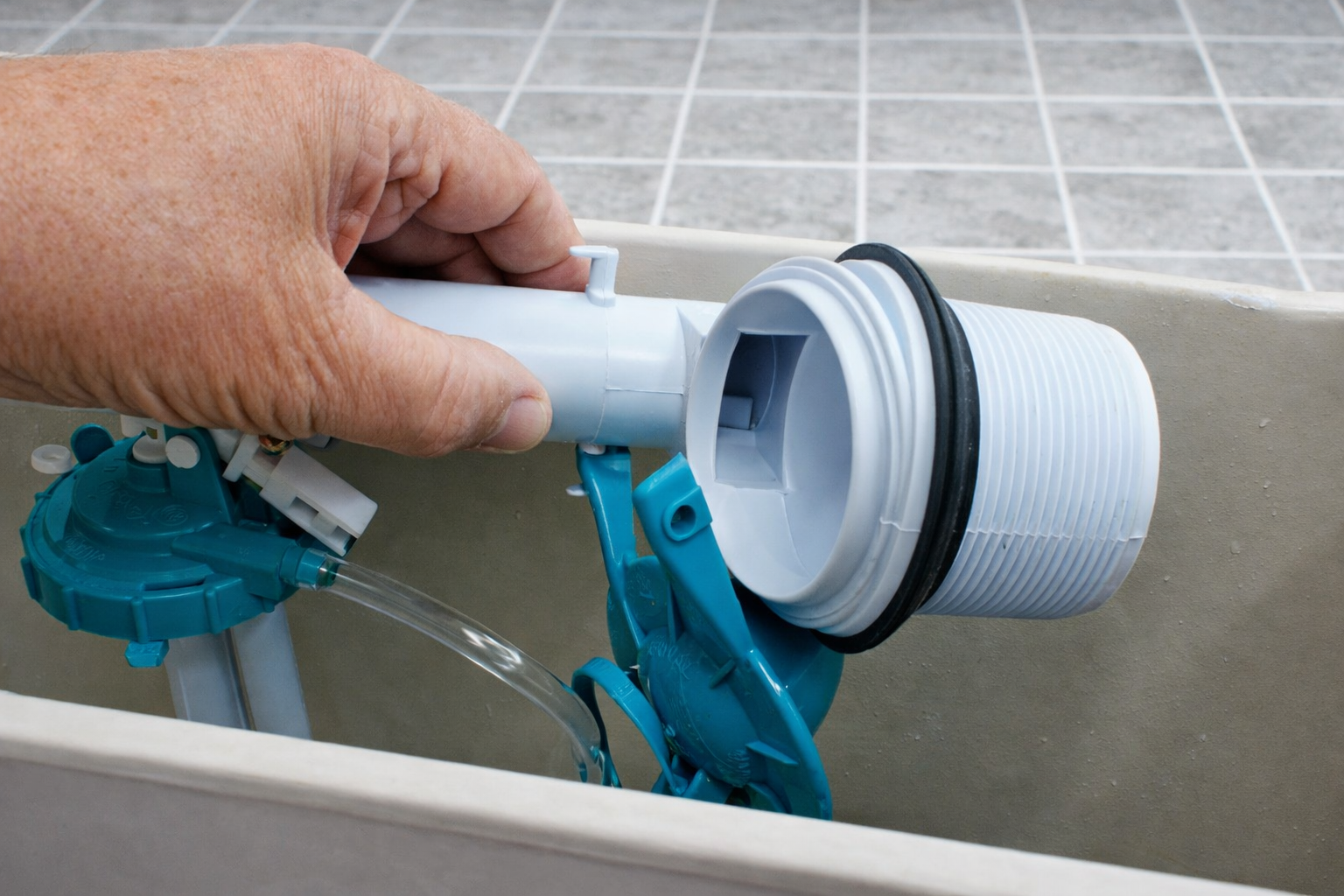 Professional toilet overflow repair inside a toilet tank by SENIOR PLUMBERS™
